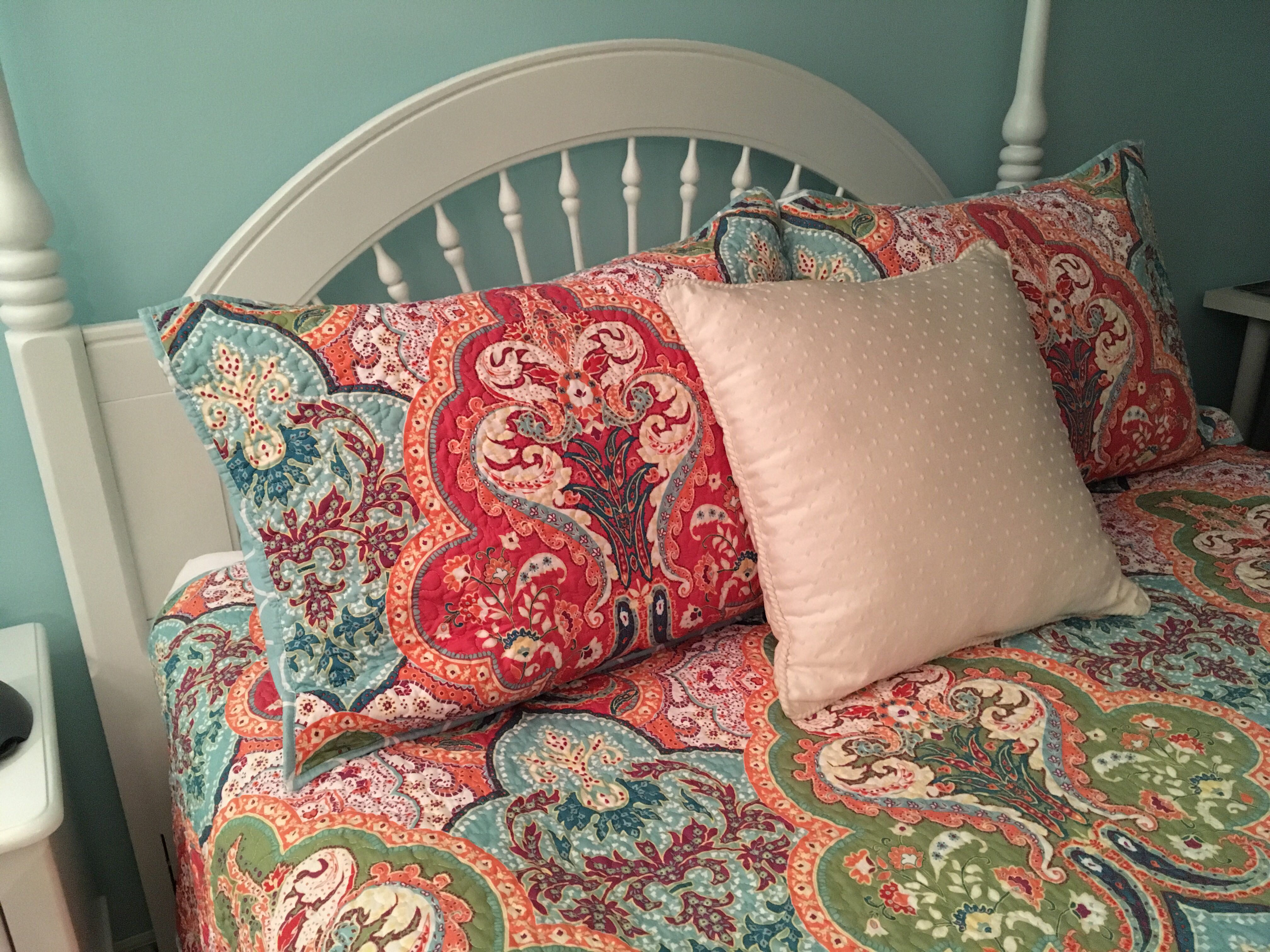 Showcasing a bedroom redesign with new furniture, paint, and indoor décor.